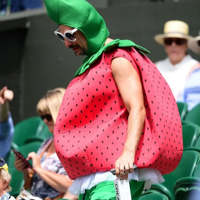 A person dressed like a strawberry